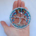 small tree of life shown in persons hand to gauge actual size of 3 inches